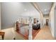 View from the upper level overlooks an open-concept living room with hardwood floors and lots of natural light at 2688 S Oscar Ct, Morgantown, IN 46160