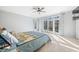 Spacious main bedroom features a ceiling fan and patio doors leading to backyard at 2688 S Oscar Ct, Morgantown, IN 46160