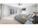 Bright main bedroom with a ceiling fan and patio doors leading to backyard at 2688 S Oscar Ct, Morgantown, IN 46160