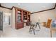 Office with custom built-ins and a large desk illuminated by natural light at 2688 S Oscar Ct, Morgantown, IN 46160