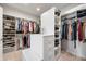 Large walk-in closet with clothing racks, custom shelves, and center island at 2688 S Oscar Ct, Morgantown, IN 46160