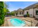 Relaxing backyard featuring a hot tub, outdoor seating, and serene landscaping at 286 S Woodridge Dr, Pittsboro, IN 46167