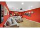 Media room with large sectional sofa, projector, and Hollywood-themed decor at 286 S Woodridge Dr, Pittsboro, IN 46167