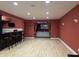 Spacious finished basement featuring a wet bar, recessed lighting, and an adjacent home theater area at 286 S Woodridge Dr, Pittsboro, IN 46167