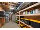 Unfinished basement provides ample storage with shelves, and industrial utilities at 286 S Woodridge Dr, Pittsboro, IN 46167