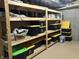 Basement features organized storage shelves with storage containers and ample room at 286 S Woodridge Dr, Pittsboro, IN 46167