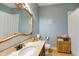 Inviting bathroom with a vintage mirror, neutral color scheme, and a tiled floor at 286 S Woodridge Dr, Pittsboro, IN 46167