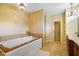 This luxurious bathroom features a large soaking tub and a double vanity at 286 S Woodridge Dr, Pittsboro, IN 46167