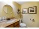 Bathroom showcases a marble countertop, unique fixtures, and framed art at 286 S Woodridge Dr, Pittsboro, IN 46167