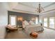 This cozy bedroom features a chandelier, decorative sconces, and a door to the outside at 286 S Woodridge Dr, Pittsboro, IN 46167