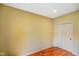 Bedroom view displays the hardwood floors and a closet with white doors at 286 S Woodridge Dr, Pittsboro, IN 46167