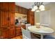 Coffee bar with wood cabinetry, granite counters, coffee machine, and decorative coffee themed accessories at 286 S Woodridge Dr, Pittsboro, IN 46167