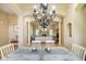 View from dining area to a living room with a fireplace and neutral-toned furniture at 286 S Woodridge Dr, Pittsboro, IN 46167