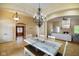Elegant dining room with chandelier and open to living area at 286 S Woodridge Dr, Pittsboro, IN 46167