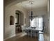 Elegant dining area features stylish lighting, neutral decor, and lots of natural light at 286 S Woodridge Dr, Pittsboro, IN 46167