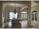 Elegant dining room with chandelier, neutral walls, and abundant natural light at 286 S Woodridge Dr, Pittsboro, IN 46167