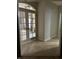 Inviting entryway features tiled floors and French doors leading to another room filled with natural light at 286 S Woodridge Dr, Pittsboro, IN 46167