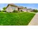 Lush front lawn and landscaping accent this charming single-story home with a three-car garage at 286 S Woodridge Dr, Pittsboro, IN 46167