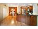Large kitchen with wooden cabinets, hardwood floors and breakfast nook at 286 S Woodridge Dr, Pittsboro, IN 46167