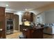 Bright kitchen with wood cabinets, stainless steel appliances, and an island at 286 S Woodridge Dr, Pittsboro, IN 46167