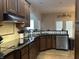 Modern kitchen features granite countertops and stainless steel appliances at 286 S Woodridge Dr, Pittsboro, IN 46167