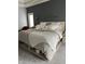 Comfortable main bedroom with stylish decor, soft lighting, and a cozy bed, creating a relaxing retreat at 286 S Woodridge Dr, Pittsboro, IN 46167