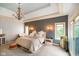 Elegant main bedroom featuring a chandelier, decorative wall sconces, and plenty of natural light at 286 S Woodridge Dr, Pittsboro, IN 46167
