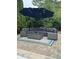 Backyard patio featuring comfortable outdoor seating under a large umbrella, perfect for entertaining at 286 S Woodridge Dr, Pittsboro, IN 46167