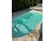 Refreshing backyard pool featuring clean lines, providing a tranquil escape for relaxation and enjoyment at 286 S Woodridge Dr, Pittsboro, IN 46167