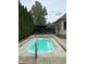 Backyard showcasing a small inground pool with patio furniture in a well-maintained backyard at 286 S Woodridge Dr, Pittsboro, IN 46167