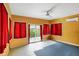 Enclosed sunroom with ceiling fan and sliding glass doors to the exterior at 286 S Woodridge Dr, Pittsboro, IN 46167