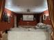 Home theater featuring a large screen, projector, comfortable seating, and elegant curtains at 286 S Woodridge Dr, Pittsboro, IN 46167