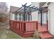 Wood deck with decorative pergola and string lights, perfect for outdoor entertaining and relaxation at 2888 Prairie Stream Way, Columbus, IN 47203