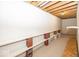 Unfinished basement features open joist ceiling and brick and cinder block shelving at 2888 Prairie Stream Way, Columbus, IN 47203