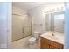 Clean bathroom with a tub-shower combo, a toilet, and a vanity with plenty of lighting at 2888 Prairie Stream Way, Columbus, IN 47203