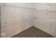 Walk-in closet featuring wire shelving and neutral carpeting at 2888 Prairie Stream Way, Columbus, IN 47203
