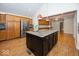 Spacious kitchen with a center island, stainless steel appliances, and ample cabinet space at 2888 Prairie Stream Way, Columbus, IN 47203