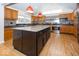 Gourmet kitchen featuring a large center island, stainless steel appliances, and custom cabinetry at 2888 Prairie Stream Way, Columbus, IN 47203