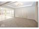 Bright living room featuring neutral carpeting and lots of natural light at 2888 Prairie Stream Way, Columbus, IN 47203