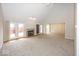 Spacious living room with a fireplace, high ceilings, and sliding doors leading to the deck at 2888 Prairie Stream Way, Columbus, IN 47203