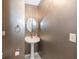 Modern half-bathroom with pedestal sink and textured wallpaper at 2888 Prairie Stream Way, Columbus, IN 47203