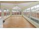 Sunroom with vaulted ceilings, bright windows, and natural light at 2888 Prairie Stream Way, Columbus, IN 47203