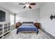 Comfortable bedroom with a large bed, windows, and modern decor at 3229 Autumn Ash Dr, Zionsville, IN 46077