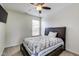 Bright bedroom with a cozy bed, featuring natural light from the window at 3229 Autumn Ash Dr, Zionsville, IN 46077