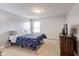 Cozy bedroom features neutral walls and a window providing natural light at 3229 Autumn Ash Dr, Zionsville, IN 46077