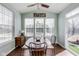 Cozy dining area with vaulted ceilings, bright windows, and stylish decor, perfect for Gathering meals at 3229 Autumn Ash Dr, Zionsville, IN 46077