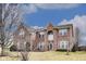 Charming two-story brick home with a well-manicured lawn and beautiful architectural details at 3229 Autumn Ash Dr, Zionsville, IN 46077