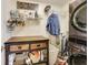 Well-equipped laundry room with modern washer/dryer, storage, and folding area at 3229 Autumn Ash Dr, Zionsville, IN 46077