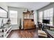 Home office with wood floors, large windows, and a stylish desk setup for a productive workspace at 3229 Autumn Ash Dr, Zionsville, IN 46077