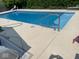 Outdoor pool with concrete deck and metal railing for easy access at 3229 Autumn Ash Dr, Zionsville, IN 46077